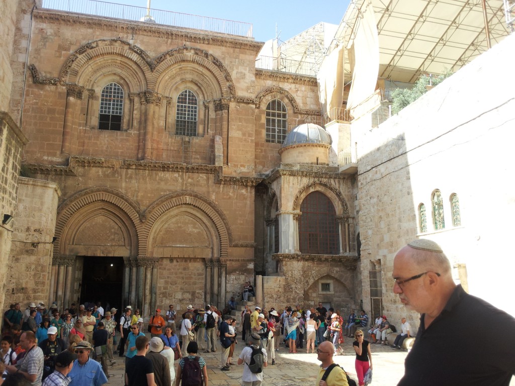The plaza and entrance to The Church of the Holy Sepulchre. This site is honored as the site of Golgotha, the "Place of Skulls," where Jesus Christ was crucified and later resurrected. History and archaeology place the location of crucifixions in this city at the outskirts of the city, not in what would have been a center of the city in 33 A.D. Many religions lay claim to this church; it is subdivided into many pieces, each claimed by a sect of Christianity.