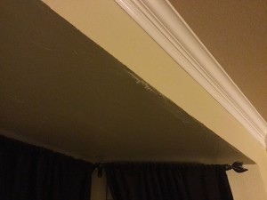 Water drips from the seam in the drywall of the alcove ceiling in our bedroom during a very bad rain storm. This picture was taken at 3am.