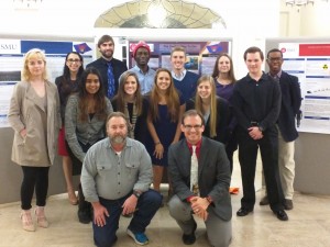 After an evening of presenting their work, the students posed with the instructors for a last photo of the semester.