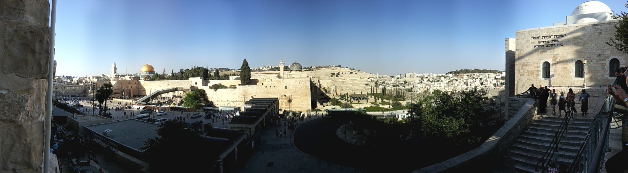 The plaza in front of the exposed section of the Western Wall of the second Jewish Temple (the "Wailing Wall"). Visible in the panorama is the Mount of Olives and various key locations in Jewish and Muslim theology, including the place of resurrection of all Jews and both Jewish (Gehenna) and Muslim hells (Jahannam).