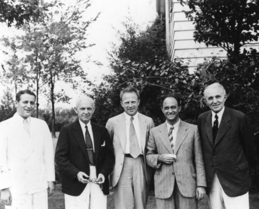 At the yearly Michigan Symposium in Theoretical Physics: left to right: Samuel Goudsmit, Clarence Yoakum (Dean, University of Michigan Graduate School), Werner Heisenberg, Enrico Fermi, Edward Kraus, in Ann Arbor, Michigan.