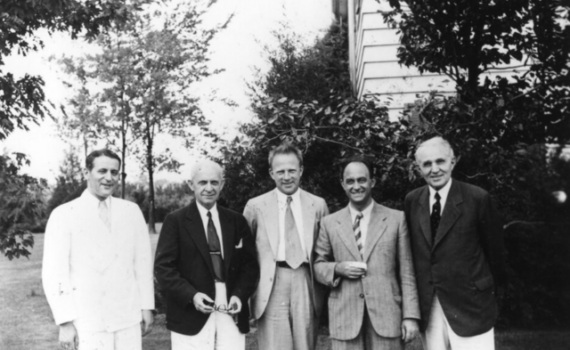 At the yearly Michigan Symposium in Theoretical Physics: left to right: Samuel Goudsmit, Clarence Yoakum (Dean, University of Michigan Graduate School), Werner Heisenberg, Enrico Fermi, Edward Kraus, in Ann Arbor, Michigan.
