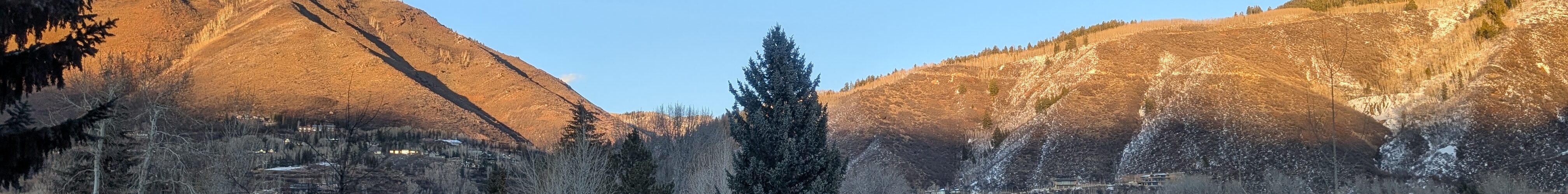 A view of mountains from a street in Aspen, CO, USA