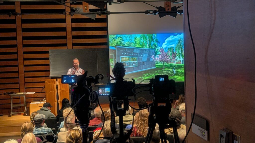 Dr. Kyle Cranmer opens his public lecture on machine learning and artificial intelligence to a packed hall.