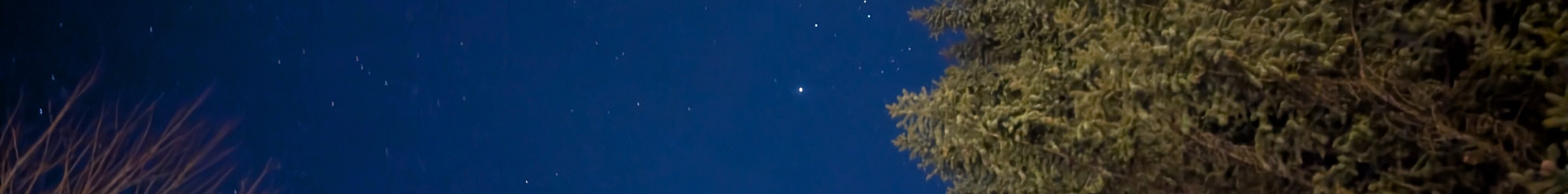 A long-exposure photograph of the night sky over the Aspen Center for Physics