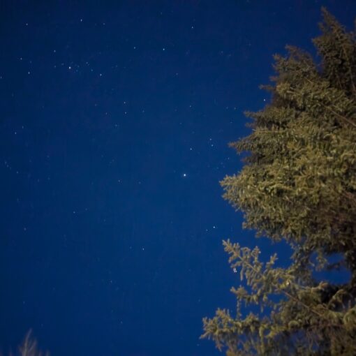 A long-exposure photograph of the night sky over the Aspen Center for Physics