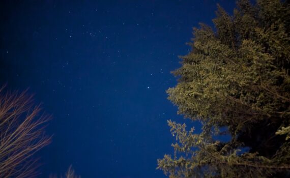A long-exposure photograph of the night sky over the Aspen Center for Physics
