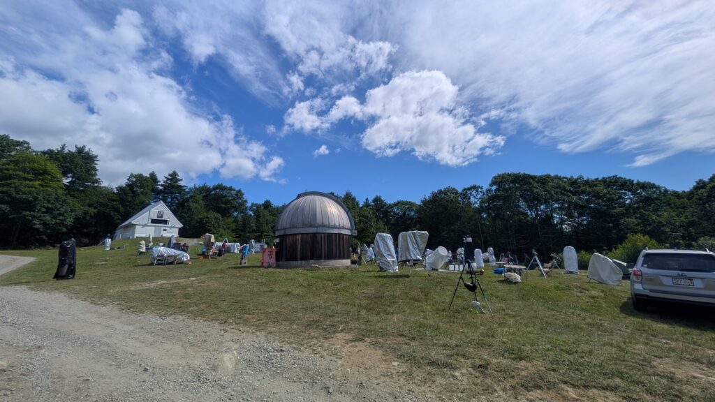 The viewing hill at Stellafane East, with the McGregor Observatory in the back at the top of the hill.