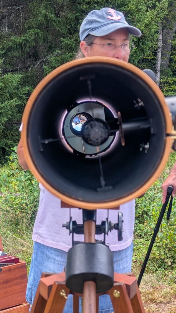 A beautiful telescope built from upcycled items, such as window latches and sink drains.